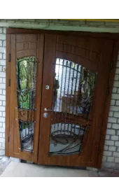 Броньовані двері зі склом і ковкою, модель «Лотос» Броньовані двері зі склом і ковкою, модель «Лотос»